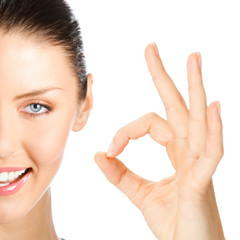 Happy smiling woman with okay gesture, isolated