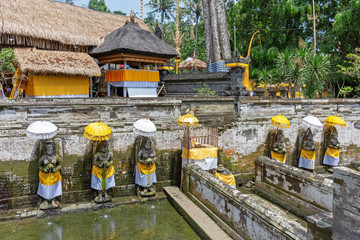 Holy spring water at Goa Gajah temple or also known as Elephant cave in Sukawati district Bali,...