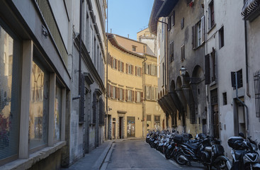 Walk through the old and narrow streets of Florence near the Cathedral of Santa Maria del Fiore. Italy.
