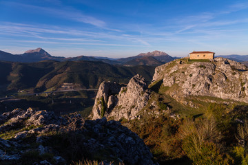 Ermitage of Aitzorrotz at the top of the rock in Eskoriatza, Basque Country.