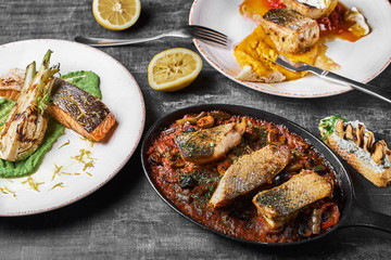 Three-course fish platter Pike perch, salmon steak, Stewed perch.. Dietary menu. Fish menu. Seafood. Concept of healthy food.