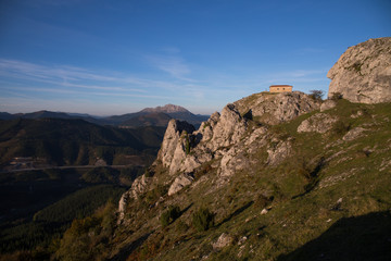 Ermitage of Aitzorrotz at the top of the rock in Eskoriatza, Basque Country.