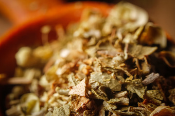 Dried oregano spice in a spoon. Extreme macro photography.