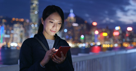 Woman use of mobile phone at night