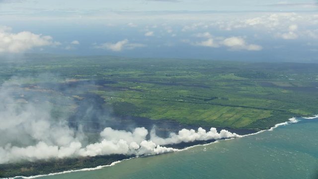 Aerial view Kilauea volcanic lava entering Pacific ocean