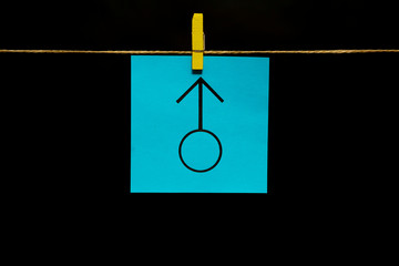 One sticker. Copy space. On the blue sheet is image of boy symbol. © Вячеслав Козырев
