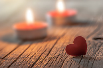 Red Heart with candle on wooden backdrop. Happy valentines day. St. Valentine background. Holidays...