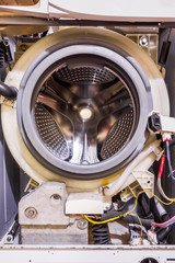 Washing machine disassembled. Washing machine repair, front view.