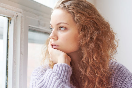 Portrait Of A Beautiful Young Girl. Pensive Face Close. Melancholy Teenager