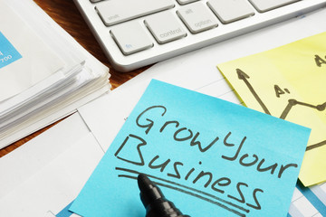 Grow your business concept. Financial documents on a table.