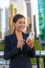 Woman using phone - Asian businesswoman holding smartphone texting on messenger app online to...