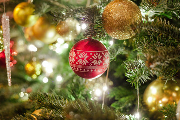 Closeup on Christmas tree decoration over festive background