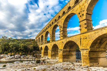 Tourist in the Pont du Gard Unesco Heritage site in France in a late afternoon light in France