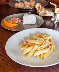 Penne with salmon, cod and walnuts