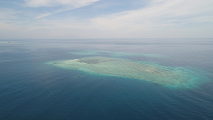 seascape aerial view coral reef, atoll with turquoise water in sea.Tropical atoll, coral reef in...