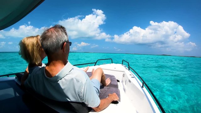 Carefree retired couple having yacht trip outdoor Bahamas