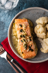 Solomon fillet with pineapple and cauliflower. Fish with vegetables.