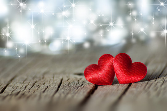 two Red Heart bokeh bright background on wooden backdrop . Happy valentines day. St. Valentine background. Holidays greeting card copy space