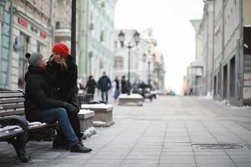 Young couple walking through the winter