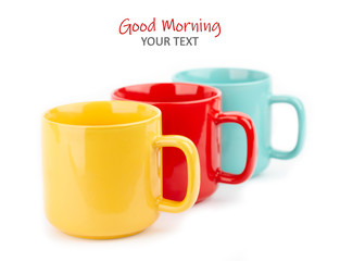 Colored cups for coffee and tea on a white background. Place for your text.