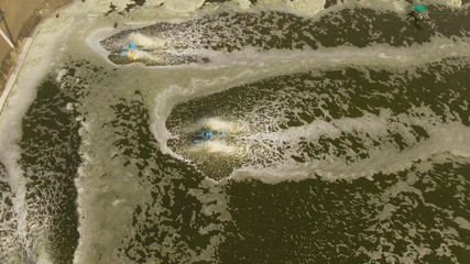 shrimp, prawn farming with with aerator pump for oxygenation water. Shrimp farms aerial view aquaculture business exported international market. java, indonesia