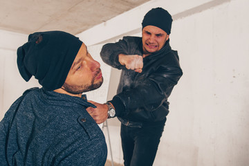 Burlgar beating his robbery partner in basement