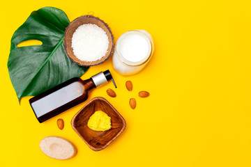 Organic skin care set on yellow background. Copy space