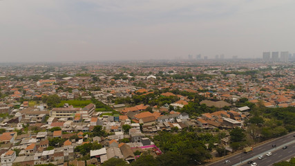 Aerial cityscape modern city Surabaya with highway, skyscrapers, buildings and houses. city skyline with skyscrapers and business centers Surabaya capital city east java, indonesia