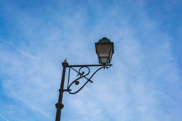 Classic street lamp in blue sky - 243178240