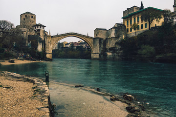 Historic Mostar Bridge on cloudy day - 243181030