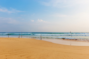 Fototapeta na wymiar Landscape of sand beach and sea with blue sky