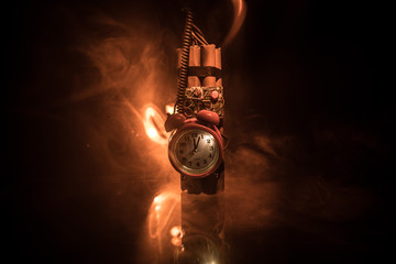 Image of a time bomb against dark background. Timer counting down to detonation illuminated in a...