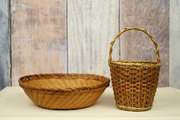 Fototapeta na wymiar old wicker basket and bowl on the table