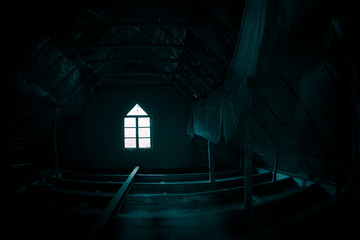 Mysterious mood created by white light in the window, subtle illuminated floor and total darkness...