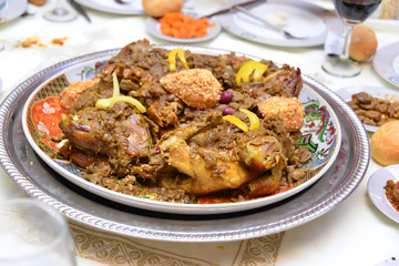 Moroccan grilled chicken. Served with lemon in a traditional Moroccan dish. The main meal at the wedding