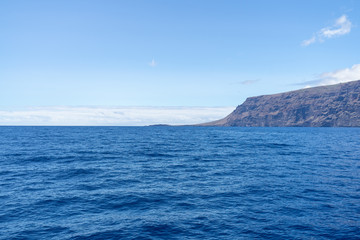 Naklejka na ściany i meble Vertical cliffs Acantilados de Los Gigantes (Cliffs of the Giants). View from Atlantic Ocean. Tenerife. Canary Islands. Spain.