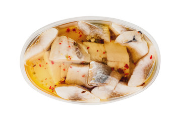One oval transparent plastic container of canned seafood and spice in marinade isolated on white background. Top view. Clipping path - image