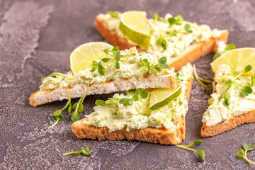 Toasts with avocado pate and fresh microgreen