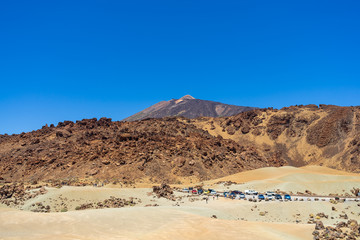 The lava fields of Las Canadas caldera of Teide volcano. Viewpoint: Minas de San Jose. In the background is the peak of the Teide volcano. Tenerife. Canary Islands. Spain.