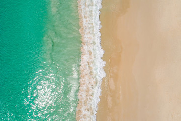 Aerial top view beautiful sea landscape, beach and wave with turquoise sea water with copy space