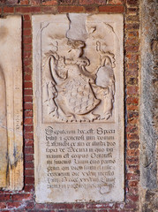 One of the Medieval gravestone on walls of the Ansperto Atrium of the Basilica of Sant'Ambrogio. Milan, Lombardy, Italy.