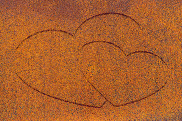 Two drawn hearts on oxide surface close-up. Rust metallic background with two painted hearts. Rust metall with love symbol graffiti. Valentine day image. Unideal iron plane with copy space.