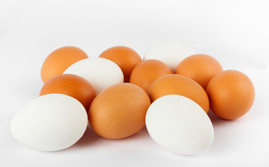 Fresh yellow chicken eggs on white background