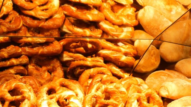 German national pretzel with sesame on the counter of fancy shop