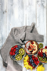 fruit bowl. Bowl of healthy fresh fruit salad on rustic background