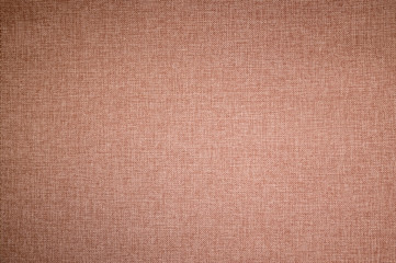 Fototapeta na wymiar Textured background surface of textile upholstery furniture close-up. burlap brown color fabric structure
