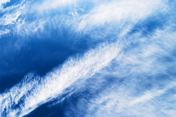 Cloudscape with with stratocumulus clouds on the blue sky.