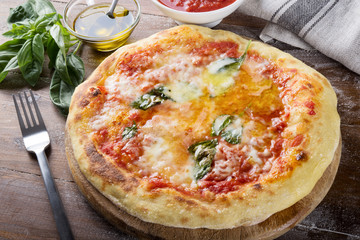 Pizza margherita on wood background