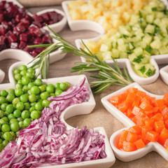 Salad for a healthy lifestyle. Venigred salad for vegans. Salad consists of beets, peas, potatoes, carrots, onions, cucumber.  Healthy eating concept.