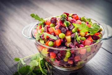 Traditional vegetarian Russian salad snack vinaigrette in a rustic recipe-.Beet Salad.Vegan cuisine.